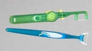 hand held dental flosser