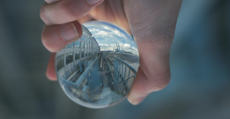 reflection of an empty factory in a glass ball