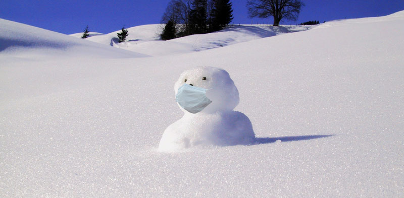 a snowman wearing a mask